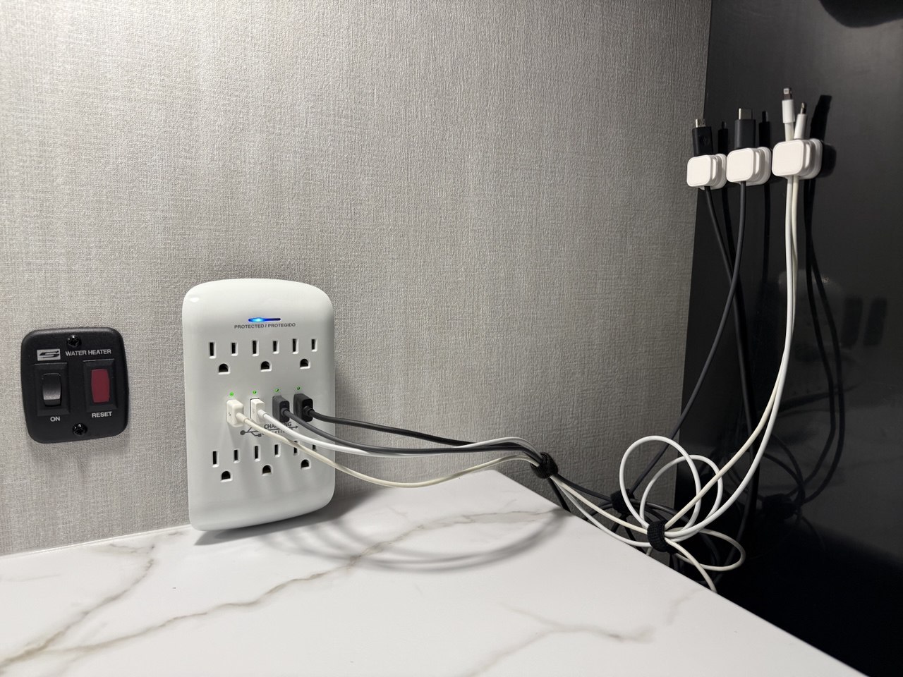 Magnetic cable clips organizing charging cables
