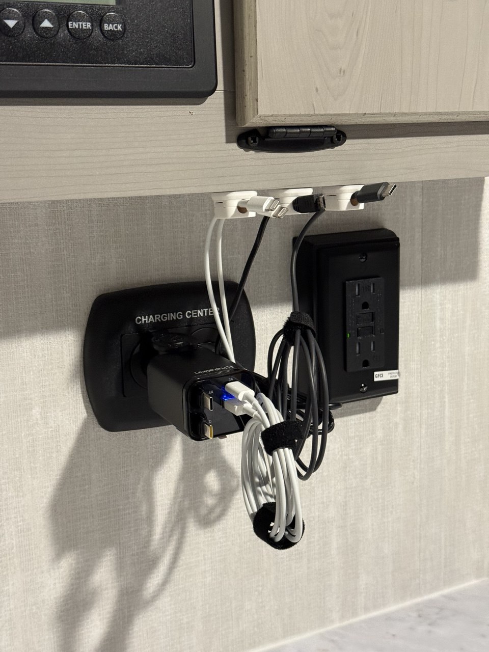 Surge protector and retractable charger setup