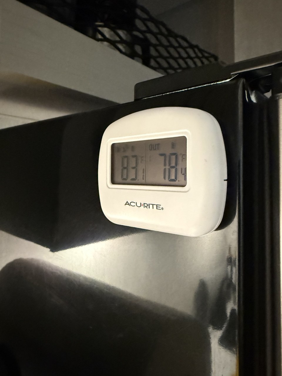 Wireless thermometer monitoring refrigerator temperature